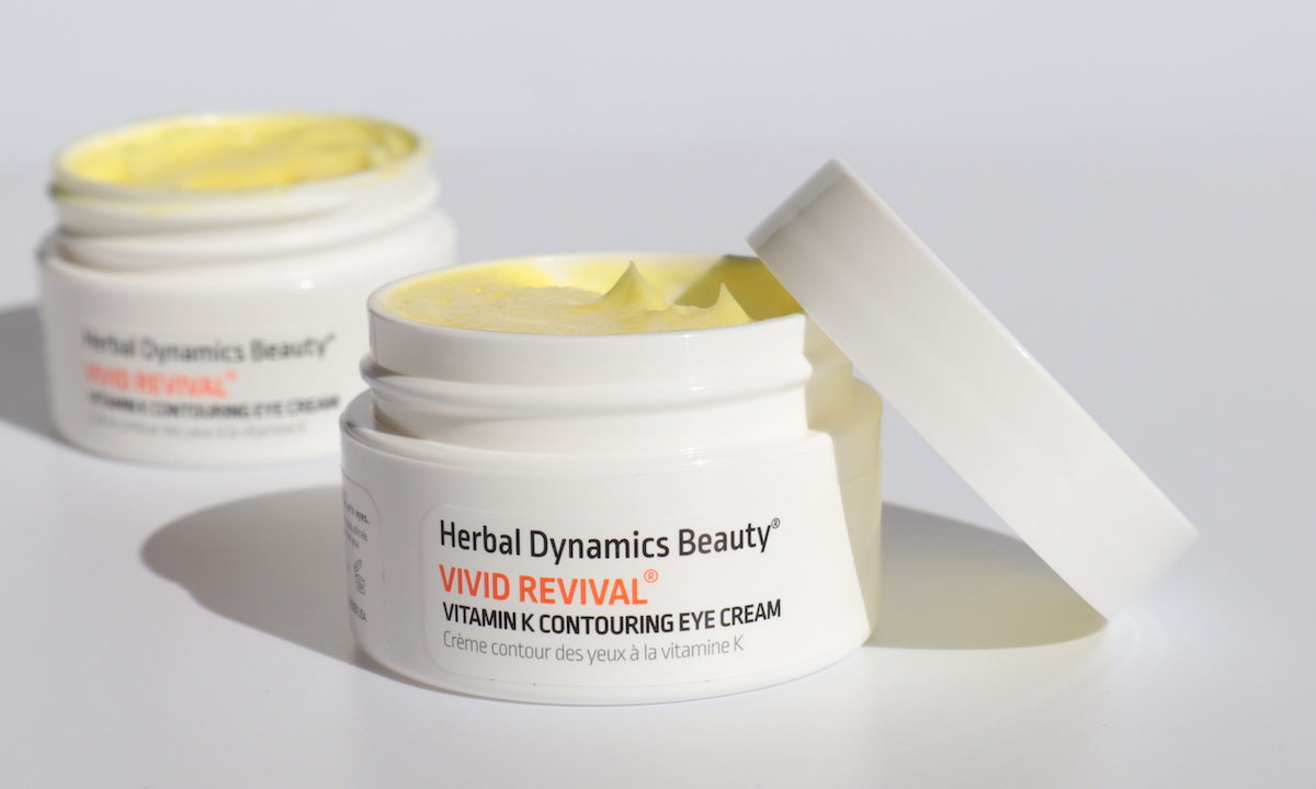 Open jars of Herbal Dynamics Beauty Vitamin K Contouring Eye Cream